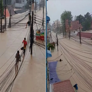 Flood victims in Hat Yai, Thailand, are walking on power lines