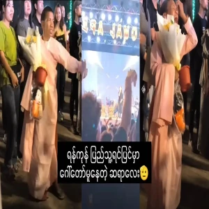A teacher practicing yoga in Yangon's public square